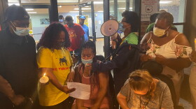 Charisse Crawford, the Gabriel Tower Tenants Union's vice president, read a statement honoring Jessie Bey at Thursday night's vigil.