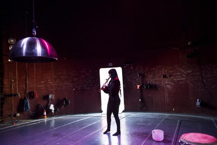 Musician Samantha Wade plays the flute inside The Tank, Center for Sonic Arts, in Rangely in July.