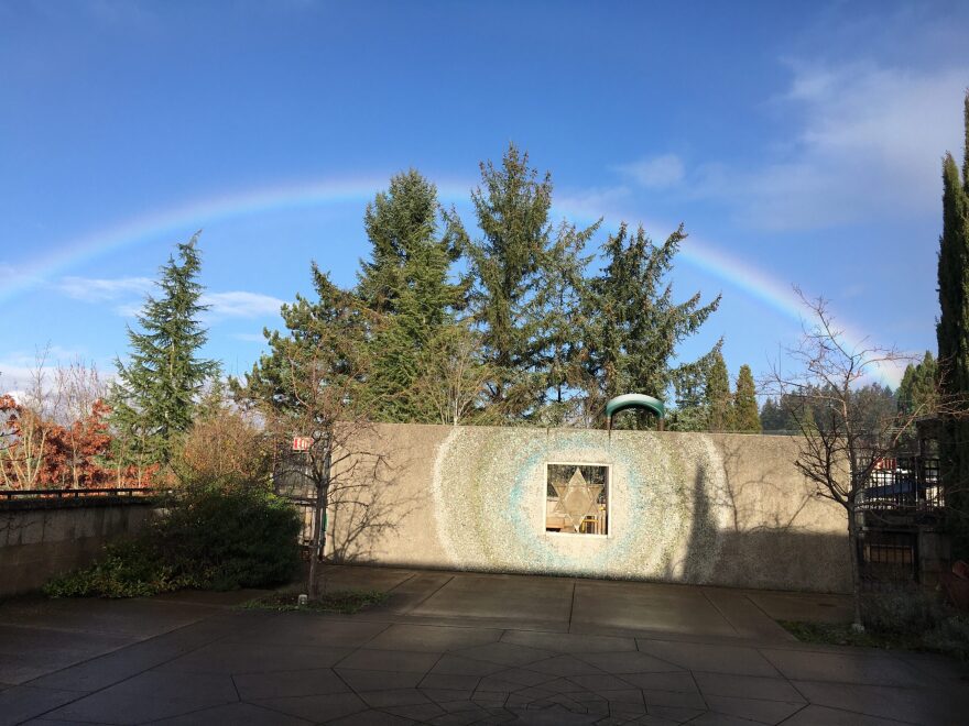 A rainbow rises over the courtyard of Temple Beth Israel, Center for Jewish life in Eugene.