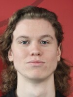 A young man poses for a headshot