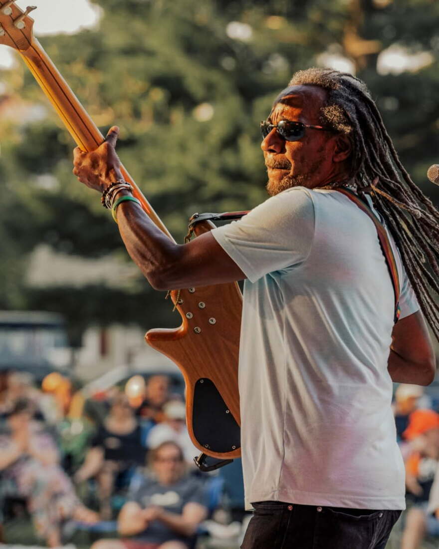A guitarist for the band Gizzae plays at the Galva summer concert series in Wiley Park.