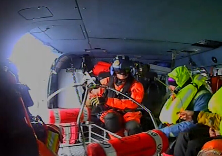 Coast Guard officials said the group abandoned their sailboat Magic Bus after it began taking on water 260 nautical miles offshore of Cape Hatteras.