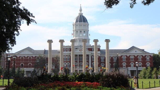 A wide shot of the MU campus columns with Jesse Hall behind