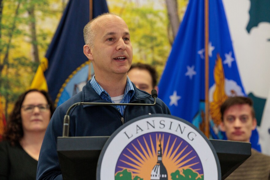 Lansing Mayor Andy Schor speaks at a press conference at Lansing City Hall on May 20, 2025, to announce the launch of the Lansing 2030 District, which aims to reduce carbon emissions from the city's aging buildings.