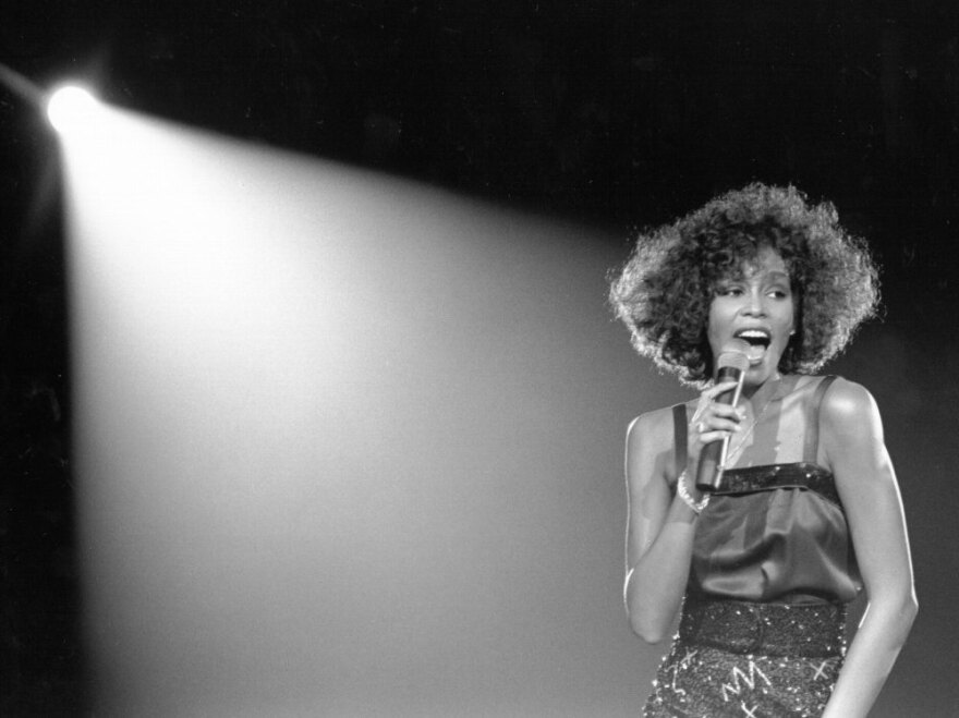 Whitney Houston performs in 1980.