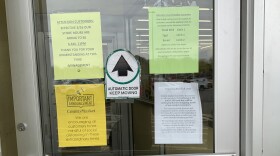 Signs inform customers of new policies at a County Market in Springfield.