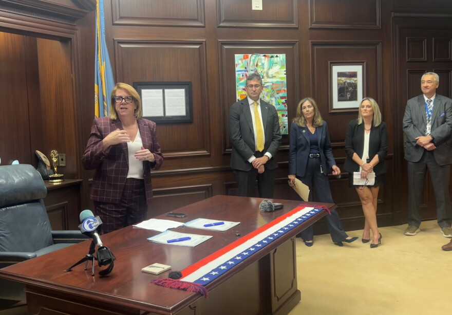 State Rep. Krista Griffith (left) speaks on HB 380 and 381.