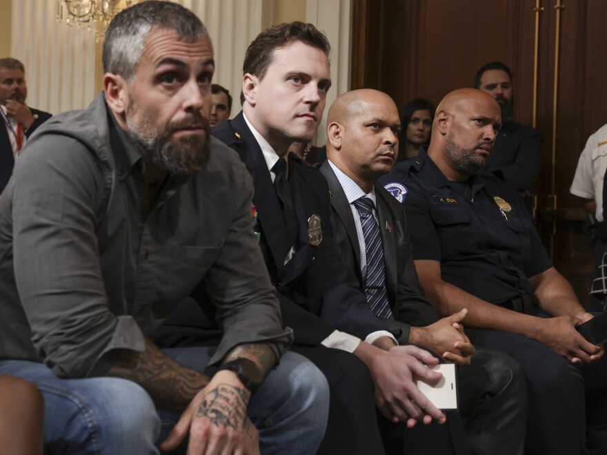 Former DC Metro Police officer Michael Fanone, Metropolitan Police Officer Daniel Hodges, Capitol Police Sergeant Aquilino Gonell, and Capitol Police officer Harry Dunn listened to evidence during an October hearing of the House Select Committee.