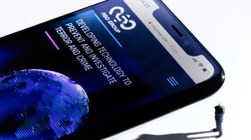 This studio photographic illustration shows a smartphone with the website of Israel's NSO Group which features 'Pegasus' spyware. (JOEL SAGET/AFP via Getty Images)