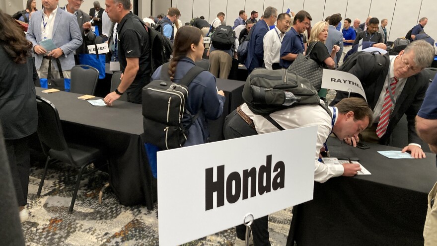 Sellers sign up for five-minute meetings with different car makers and manufacturers at the Southern Automotive Conference in Huntsville, Alabama, on October 7, 2025.