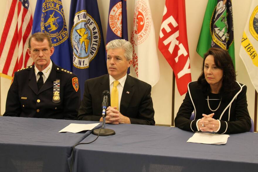 Suffolk County Executive Steve Bellone, middle, announces his nomination of FBI veteran Geraldine Hart, right, as the county's next police commissioner in 2018.