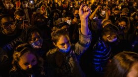 Thousands gather in Black Lives Matter Plaza near the White House to watch President-elect Joe Biden and Vice President-elect Kamala Harris speak from Delaware in Washington, DC. 