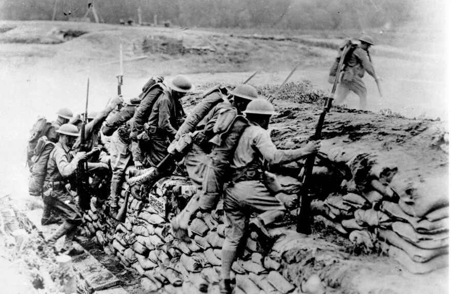 American troops climb over a sandbag barrier in France during World War I in 1918. The U.S. waited almost three years before entering the war, but the fresh American troops played a major role in deciding the outcome of a conflict that has been locked in stalemate. April 6 marks the 100th anniversary of the U.S. entrance into the war.