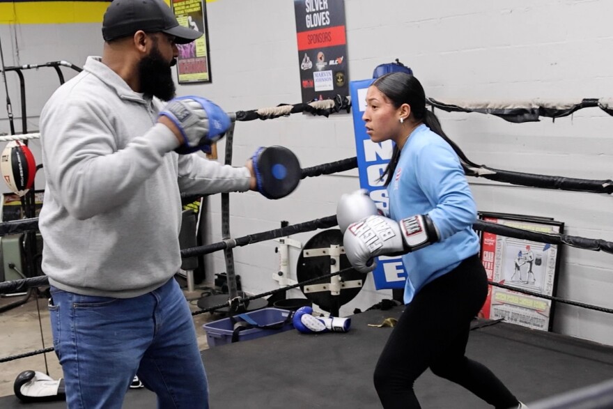 Jaden Jimenez practices with Coach Rob at the gym.