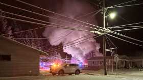 Smoke billows from a house fire 