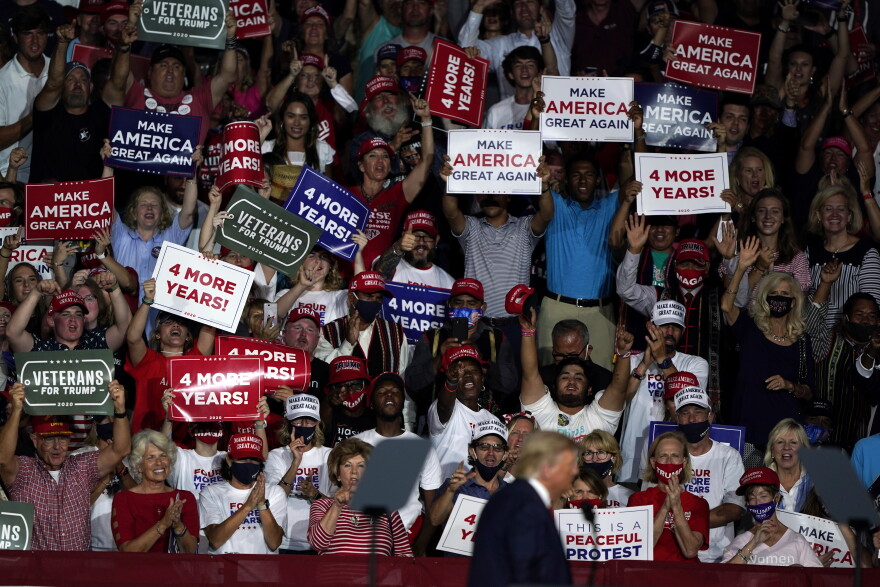 Supporters cheer after President Donald Trump spoke at a campaign rally at Smith Reynolds Airport, Tuesday, Sept. 8, 2020, in Winston-Salem, N.C.
