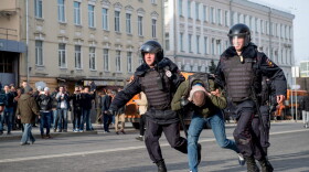 Riot police officers detain a protester during an unauthorized anti-corruption rally in central Moscow on March 26, 2017.
Thousands of Russians demonstrated across the country on March 26 to protest at corruption, defying bans on rallies which were called by prominent Kremlin critic Alexei Navalny -- who was arrested along with scores of others. (Alexander Utkin/AFP/Getty Images) 