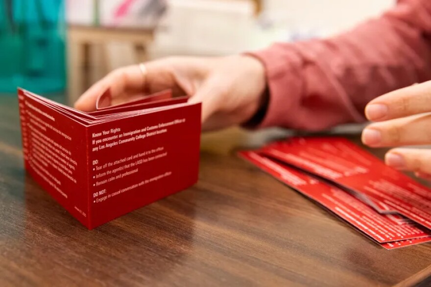 Corwin folds new “Know Your Rights” legal-tip handouts at the center at Pierce College in Woodland Hills near Los Angeles on Jan. 28, 2025.