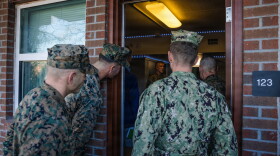 File: U.S. Marine Corps Maj. Gen. Jason G. Woodworth, commander, Marine Corps Installations Command, along with tour personnel, tours a barracks room on Marine Corps Base Camp Lejeune, North Carolina, Dec. 17, 2025. 