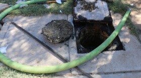 The septic tank where the dismembered body of one of the victims of a 2008 murder was found in 2014.