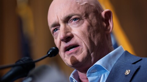 Sen. Mark Kelly, D-Ariz., refutes efforts by President Donald Trump and Defense Secretary Pete Hegseth to intimidate him and other lawmakers after expressing concerns over U.S. military strikes against vessels suspected of smuggling drugs in the Caribbean, during a news conference at the Capitol, in Washington, Dec. 1, 2025.