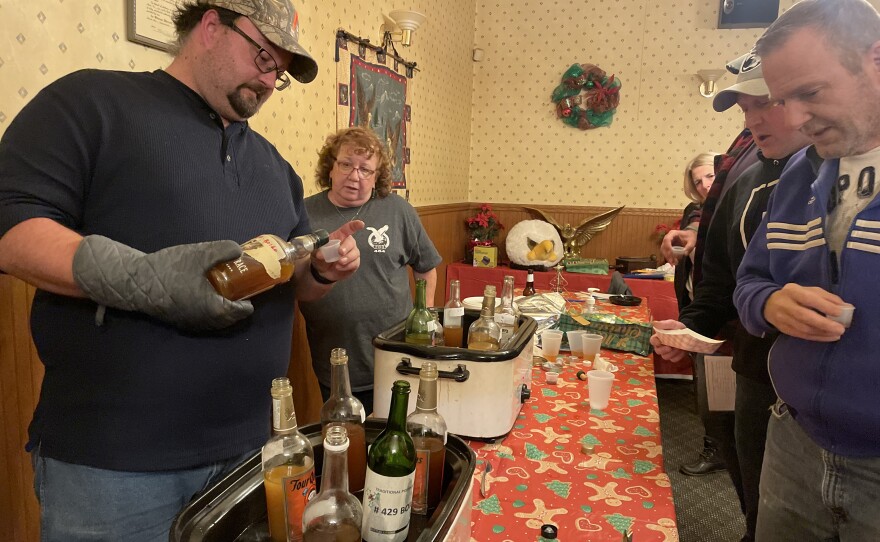 Judges lined up to try a sample of homemade boilo at the Mt. Carmel Fraternal Order of Eagles Boilo/Lemoncello contest.