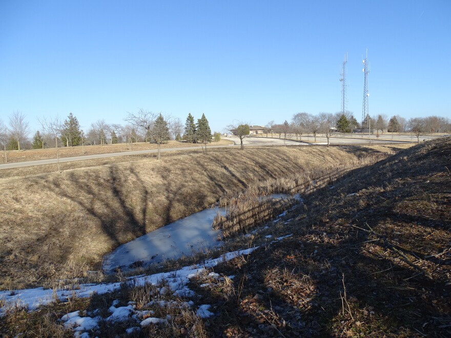 Pavement was removed and this stormwater wetland created to capture and clean rain coming off Mee-Kwon's golf course parking lot.