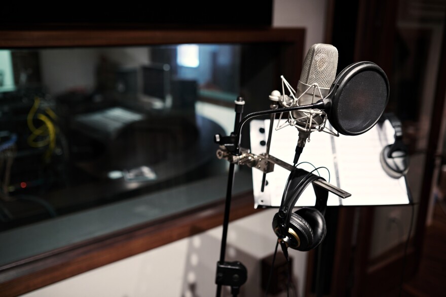 A microphone in a recording booth