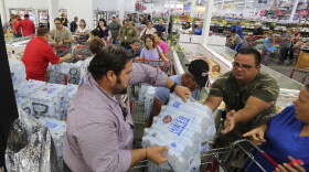 Residents purchase water at BJ Wholesale in preparation for Hurricane Irma Tuesday, Sept. 5, 2017, in Miami. Hurricane Irma grew into a dangerous Category 5 storm, the most powerful seen in the Atlantic in over a decade, and roared toward islands in the northeast Caribbean Tuesday on a path that could eventually take it to the United States. (Roberto Koltun/Miami Herald via AP)
