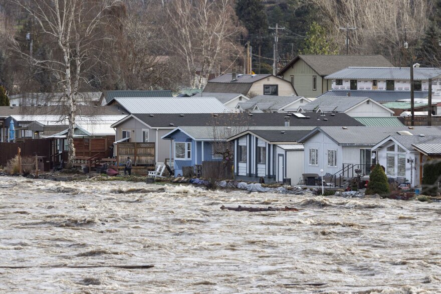 Water from the Wenatchee River begins to endanger homes at Riverbend Park Thursday in Dryden.