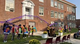 Claymont Elementary School students show their artwork of the Claymont Twelve.