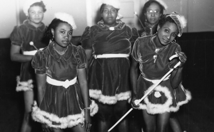This 1942 photo provided by the Louisiana State Museum shows Gold Digger Baby Dolls, one of the neighborhood groups that adopted the "baby doll" costumes.
