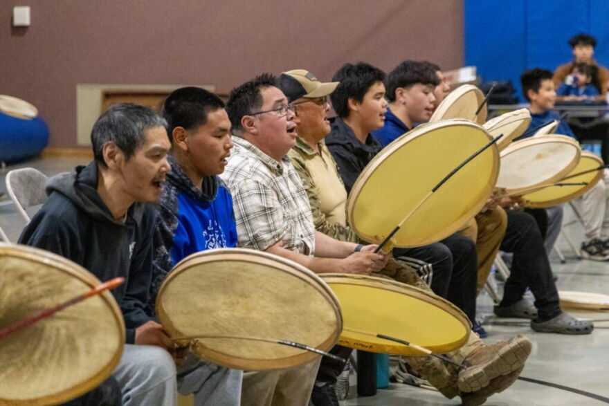 Robert Tokeinna Jr. (third in line as pictured) drums with Kingikmiut Dance Group at the 25th Annual Kingikmiut Dance Festival.