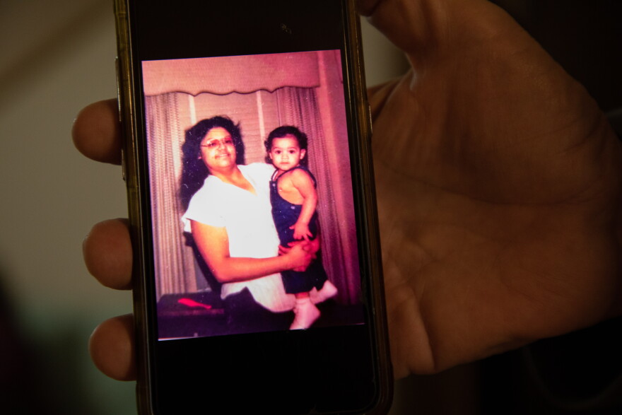 Arlene Ponce holds her son, JoJo, in an old photo. JoJo recently passed away at 41 years old. 