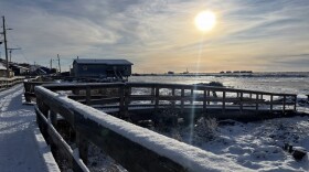 Alaska Organized Militia members, assigned to Task Force Bethel, survey Nightmute, Alaska, while conducting post-storm recovery efforts for Operation Halong Response on Oct. 27, 2025.