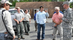 Expedition members greet Land Component Commander Army Brig. Gen. Richard Gallant (right) and Florida Fish and Wildlife Conservation Commission at Camp Blanding.