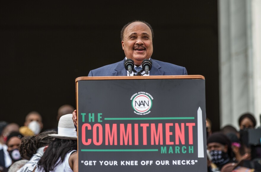 Martin Luther King III, center at bottom, speaks Friday at the Lincoln Memorial during the event dubbed "Get Your Knee Off Our Necks" in Washington.