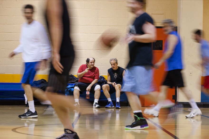 Ohanian and Breslow rest between basketball games at the Jelleff Community Center. Both have played in the same weekly pickup games for over 23 years.