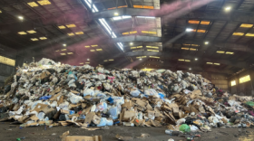 The "tipping floor," where compactors shovel piles of trash before transport to the landfill. Hazardous waste is housed in a separate facility. (Natalie Kaufman/WUFT News)