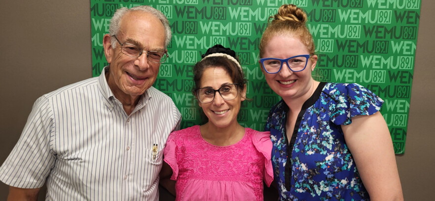 Norman Herbert and Madeline Garcia representing the Yvonne Fund at the Timko Broadcast Center with Washtenaw United host Decky Alexander in the middle.