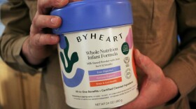 Stephen Dexter holds a container of ByHeart baby formula, which was recently recalled by ByHeart, in Flagstaff, Ariz., on Wednesday, Nov. 12, 2025.