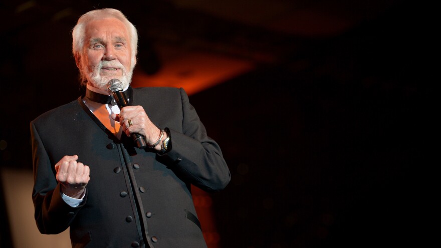 Kenny Rogers performs during Muhammad Ali's Celebrity Fight Night XX in Phoenix, Ariz., in 2014. [Charley Gallay / Getty ]