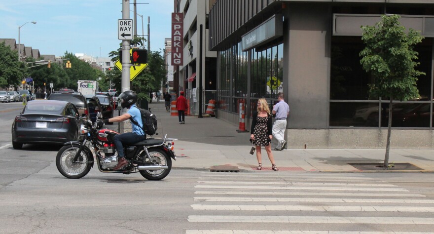 A motorcyclist drives in downtown Indianapolis.