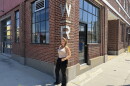 Careyann Weinberg, former director of Work|Release, outside the Texaco building in Norfolk's NEON District under the venue's original signage.