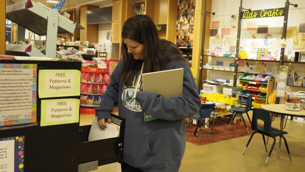 Jenni Forbes browses the filing cabinet of free patterns and magazines at the 757 Creative Reuse Center in Norfolk's MacArthur Center February 11, 2026. The center has to relocate before the mall closes at the end of June.