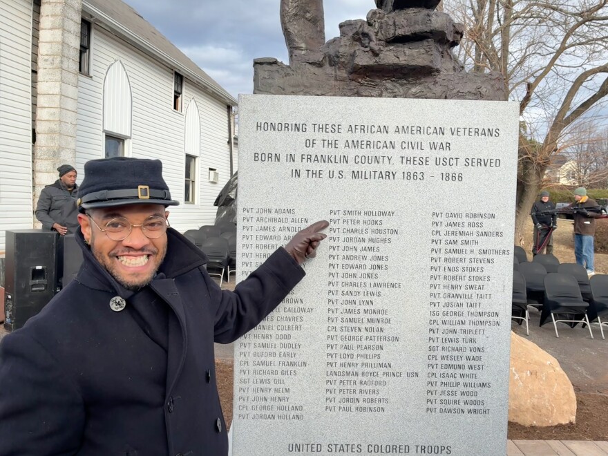 Raffeal Sears points to the name of his great-great-great grandfather Private Peter Hooks at the unveiling 70 Black men from Franklin County who fought for the United States Colored Troops during the Civil War.