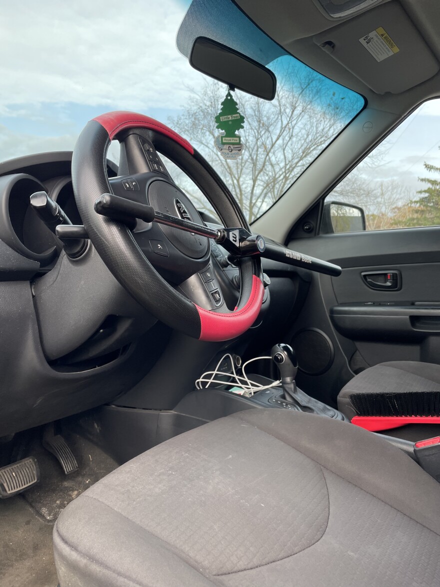 A Kia Sol is rendered immobile with a steering wheel lock due to its vulnerability to theft.