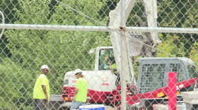 A contractor hired by Citizens Energy is cleaning up oily rocks and material from the area of the river where the oil was discharged this week.