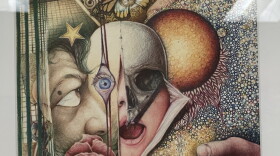 A abstract drawing with colored pencils with faces, skulls and other objects.