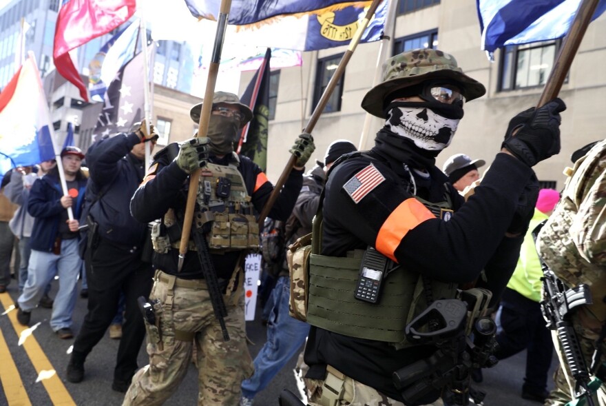 Militia groups from across the country march toward the rally.